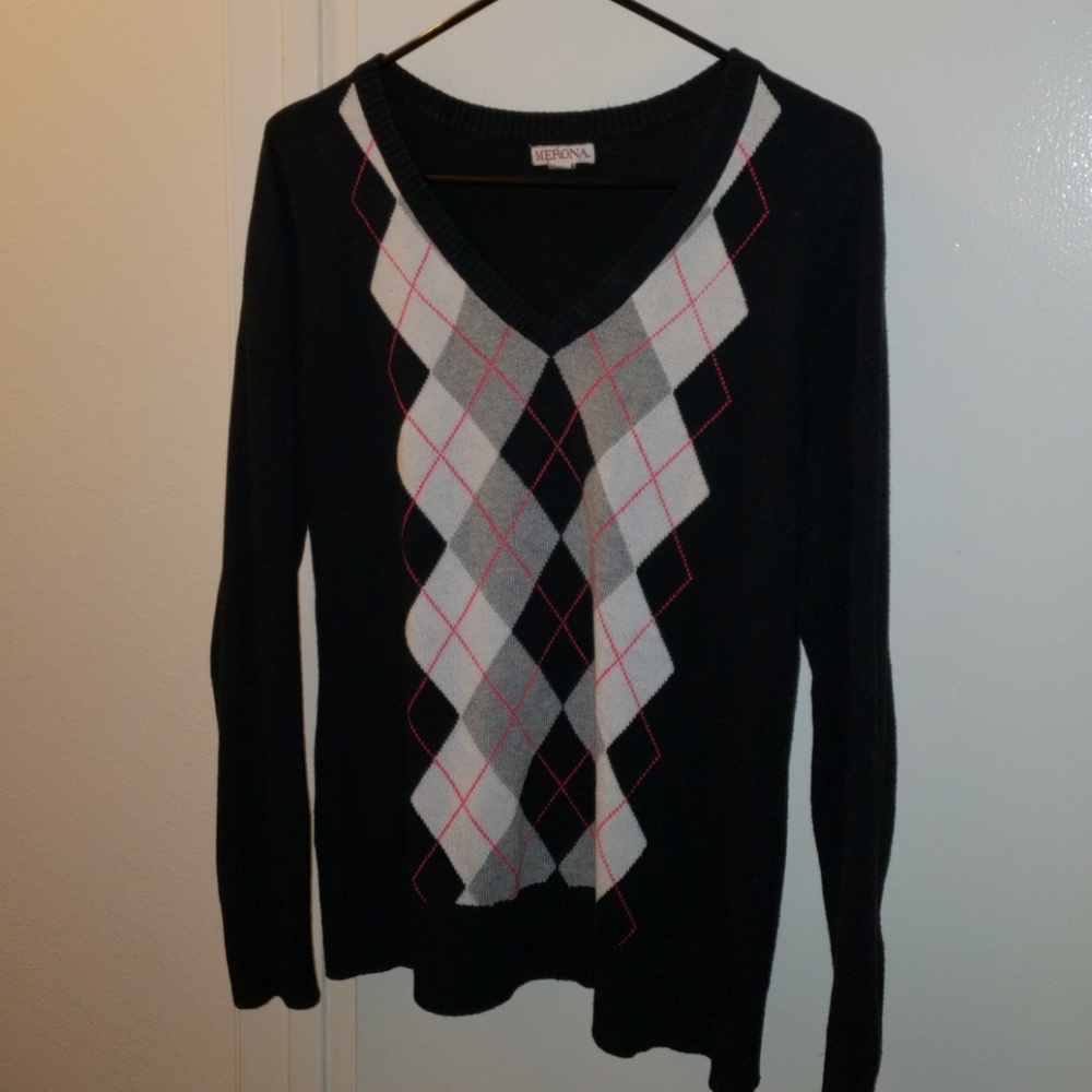 Black sweater with grey argyle print.